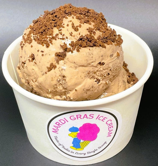 Scoop of rich chocolate ice cream swirled with chocolate cookie crumbs, served in a waffle cone or cup.